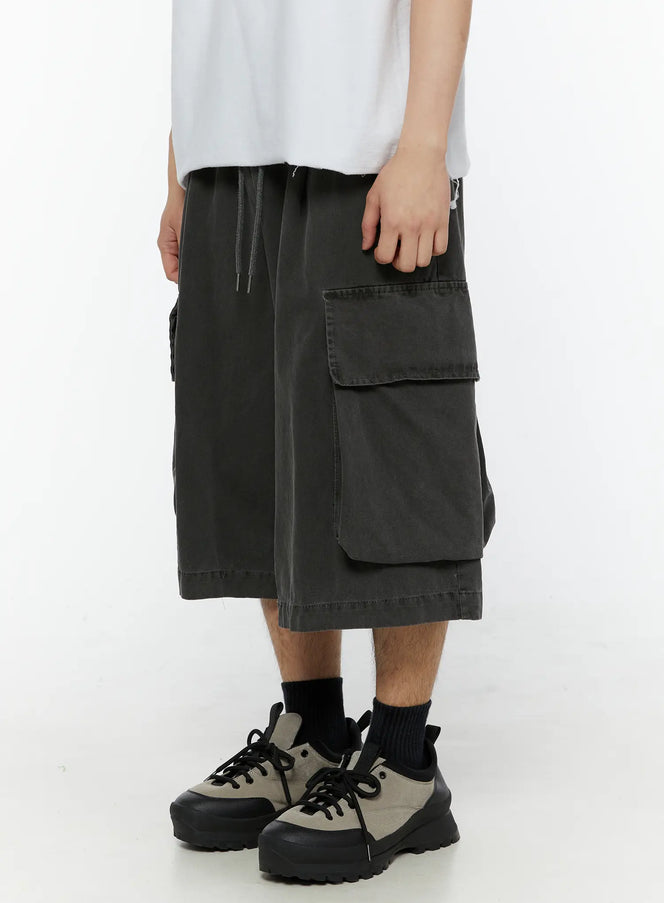 Men's Pigment Bermuda Cargo Shorts (Dark Gray) IL507 Dark gray side close-up on model showing large flap cargo pocket and drawstring elastic waistband detail