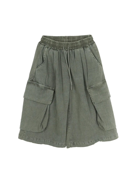 Men's Pigment Bermuda Cargo Shorts (Dark Green) IL507 Dark green flat-lay front showing elastic smocked waistband drawstring dual flap cargo pockets and layered hem