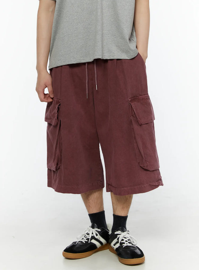 LEWKIN Men's Pigment Bermuda Cargo Shorts (Dark Pink) IL507 Dark Pink M/L front view on model paired with gray tee and sneakers, washed cotton cargo pockets