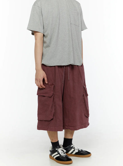 Men's Pigment Bermuda Cargo Shorts (Dark Pink) IL507 Dark Pink three-quarter back view on model with gray tee showing side cargo pocket layout and hem length