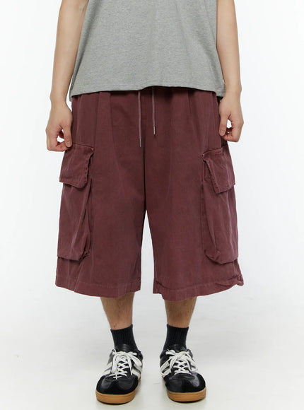 Men's Pigment Bermuda Cargo Shorts (Dark Pink) IL507 Dark Pink close-up front view on model showing drawstring elastic waistband and dual cargo flap pockets