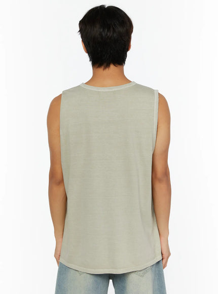 Men's Pigment Graphic Tank IL507 light beige back view on male model revealing plain washed cotton back panel and curved hem