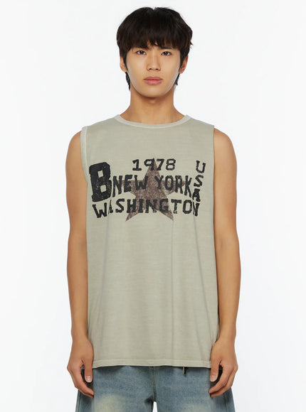Men's Pigment Graphic Tank IL507 light beige close-up front crop shot on male model highlighting faded star and distressed lettering texture