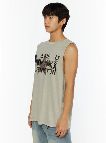Men's Pigment Graphic Tank IL507 light beige side view on male model showing relaxed fit and distressed New York Washington graphic print