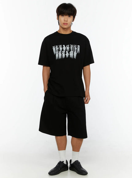 Men's Pintuck Bermuda Shorts IL515 Black full-body front shot on male model styled with graphic tee, white socks, and black sneakers, standing straight