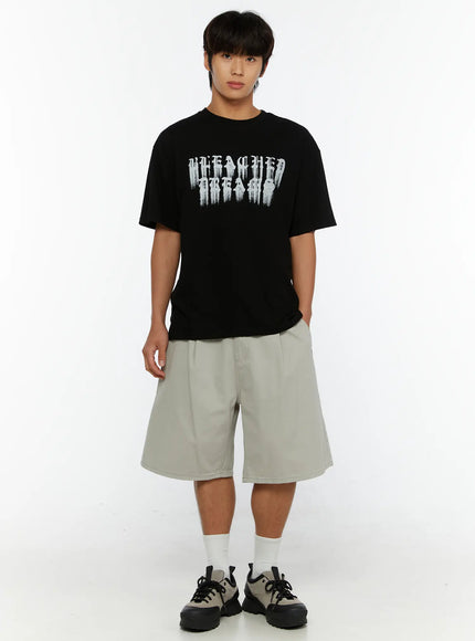 Men's Pintuck Cotton Shorts IL515 Light gray full-body front shot on male model standing upright wearing black graphic tee and chunky sneakers