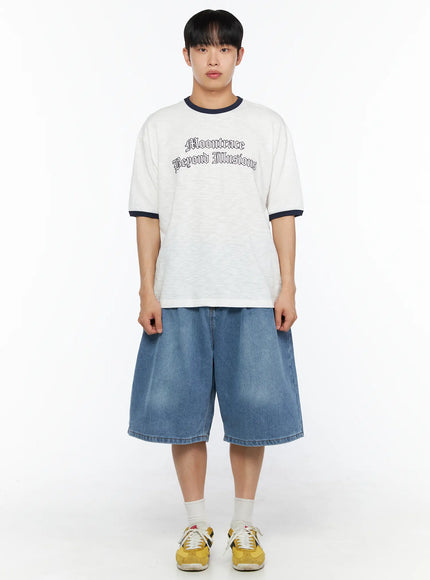Men's Pintuck Jorts IL510 Blue full-body front view on model wearing white ringer graphic tee and yellow sneakers, relaxed wide-leg silhouette