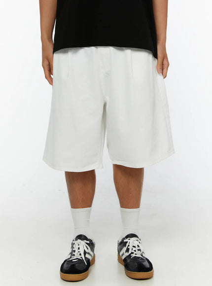 LEWKIN Men's Pintuck Wide-Fit Shorts IL515 White front view on male model wearing black graphic tee and sneakers, wide-leg silhouette