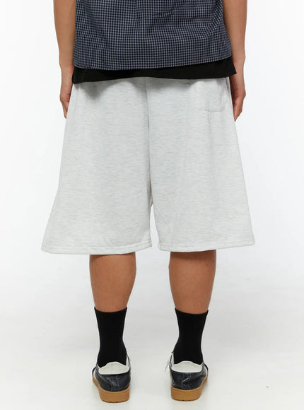 Men's Pintuck Wide Jorts IL510 light gray back view on male model showing back pocket detail and wide boxy hem in heathered cotton fabric