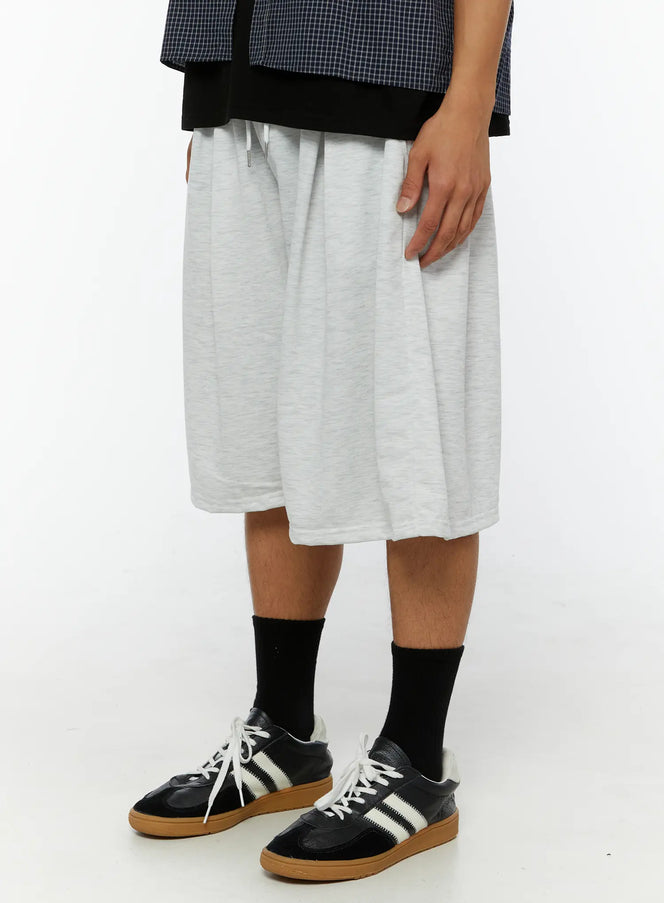 Men's Pintuck Wide Jorts IL510 light gray side view on male model showing wide-leg drape and drawstring waist with heathered cotton texture