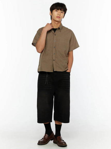 Men's Plaid Button-Up Shirt IL510 Brown three-quarter front shot on male model hand in pocket showing boxy crop length dark button placket and check weave
