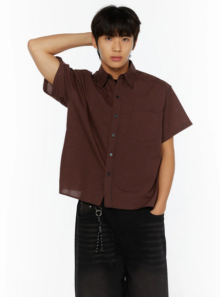 Men's Plaid Button-Up Shirt IL510 Red front half-body shot on male model hand raised behind head showing small gingham check pattern and chest pocket