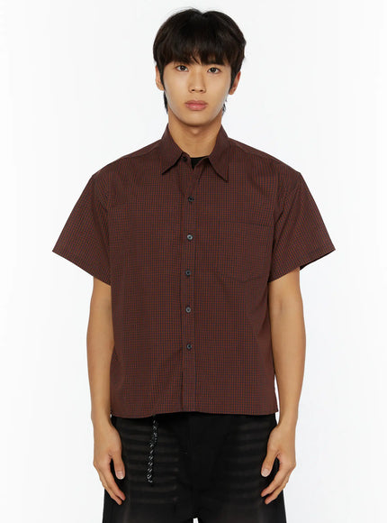 Men's Plaid Button-Up Shirt IL510 Red front half-body shot on male model arms relaxed showing boxy cropped silhouette dark buttons and small check woven fabric