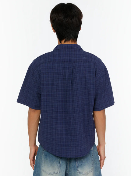 Men's Plaid Button-Up Shirt IL513 Dark blue back shot on model showing plaid texture, center back pleat, and cropped hemline with drawstring bag