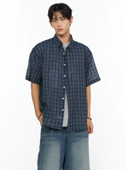 LEWKIN Men's Plaid Button-Up Shirt IL520 Dark blue front shot on male model wearing jeans, oversized short-sleeve plaid shirt with white buttons