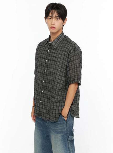 Men's Plaid Button-Up Shirt IL520 dark gray side shot on male model, short-sleeve plaid button-up with crinkle texture layered over gray tee and jeans