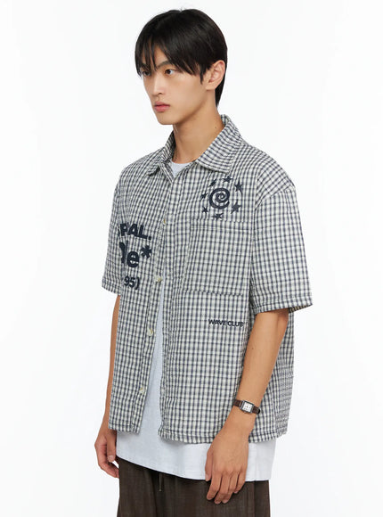 Men's Plaid Graphic Button-Up Shirt IL528 light beige side shot on male model showing SPIRAL DoNe graphic embroidery spiral star motif and WAVE CLUB text
