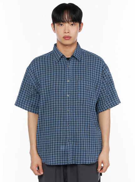 Men's Plaid Roll-Up Short Sleeve Shirt IL514 Blue front close-up shot on model from waist up showing blue plaid woven texture button placket chest pocket and point collar