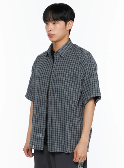 Men's Plaid Roll-Up Short Sleeve Shirt IL514 Gray M/L side shot on model turned slightly showing plaid texture oversized fit rolled cuff detail and dropped shoulder seam