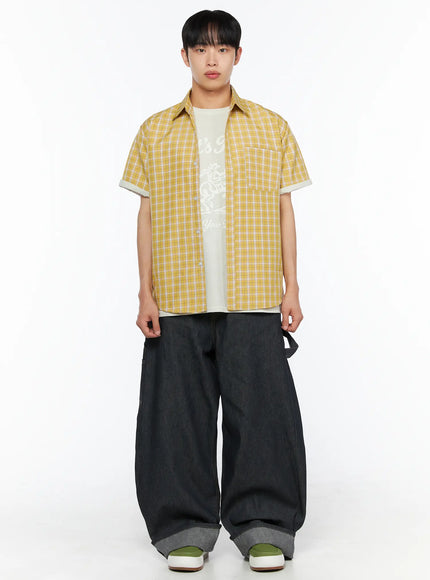 Men's Plaid Short Sleeve Shirt IL510 Yellow full-body front shot on model open unbuttoned over white graphic tee styled with dark wide-leg denim