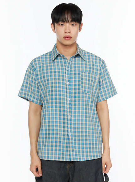 Men's Plaid Short Sleeve Shirt IL510 Blue cropped front shot on model showing point collar chest pocket white button placket and plaid woven fabric texture