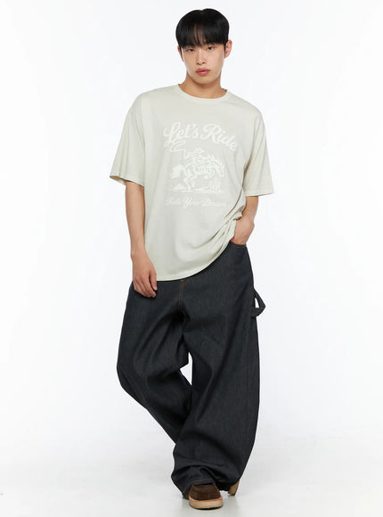 Men's Plaid Short Sleeve Shirt IL510 Yellow full-body front shot on model wearing layered over graphic tee with hand in pocket and wide-leg jeans