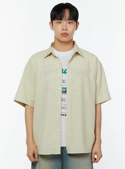 Men's Plaid Short Sleeve Shirt IU529 Light yellow front cropped shot on male model showing open button placket point collar and fine plaid weave layered over graphic tee