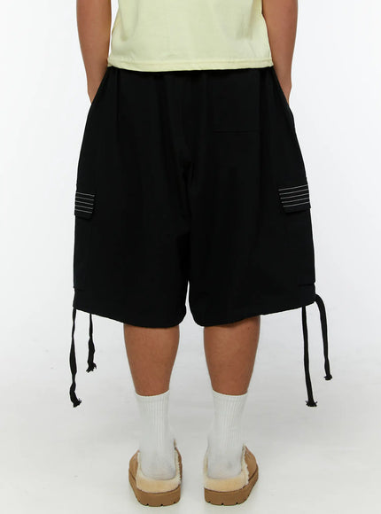 Men's Pocket Cargo Shorts IL515 Black back shot on model showing elastic waistband rear cargo pockets with white stitch and drawstring hem
