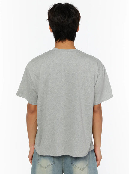 Men's Pocket Semi-Crop T-Shirt IL507 Gray back shot on male model showing rounded hem semi-crop length drop shoulder and clean back panel in heathered cotton