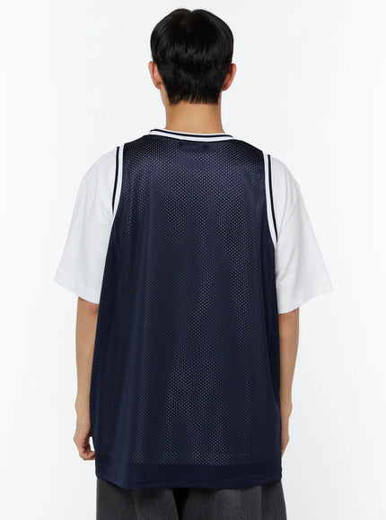 Men's Print Basketball Vest IU529 Navy back shot on model showing plain navy perforated mesh back panel with white stripe neckline trim layered over white tee