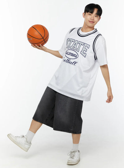 LEWKIN Men's Print Basketball Vest IU529 White front shot on model holding basketball dynamic pose layered over white tee with dark denim shorts mesh fabric