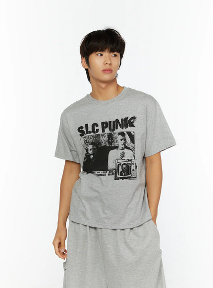 Men's Punk Graphic T-Shirt IL513 Gray front close-up shot on male model looking away showing SLC PUNK black graphic print on cotton tee