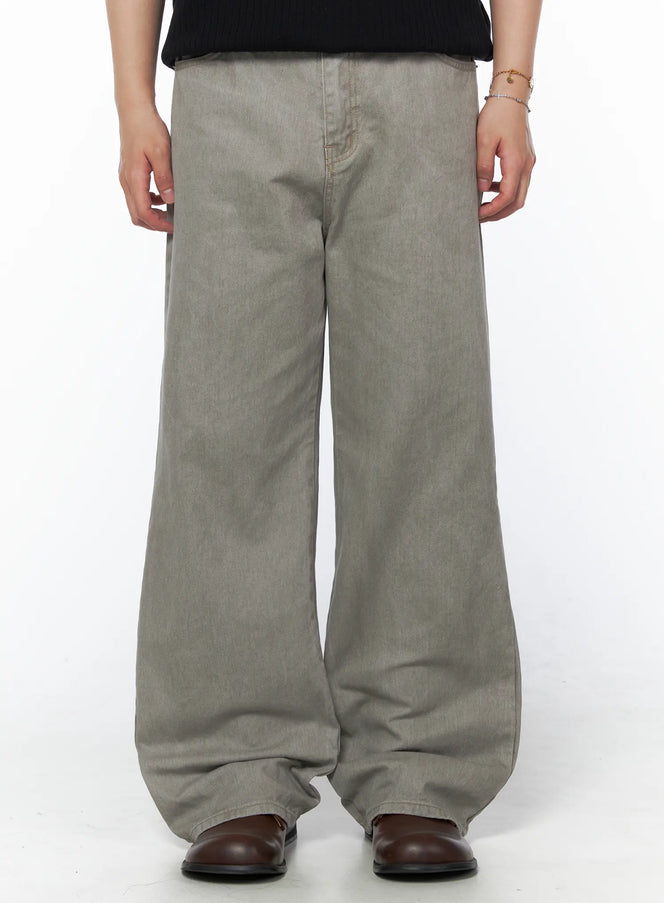 Men's Relaxed Fit Pants (Light Gray) IU523 Light Gray front crop shot on model showing wide-leg denim silhouette with brown leather boots