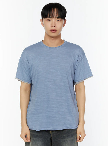 Men's Relaxed Fit T-Shirt IU529 Blue front half-body shot on male model standing straight showing relaxed fit slub fabric and contrast layered sleeve cuffs