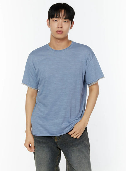 Men's Relaxed Fit T-Shirt IU529 Blue front half-body shot on male model one hand at hip showing slub texture crew neck and layered sleeve detail