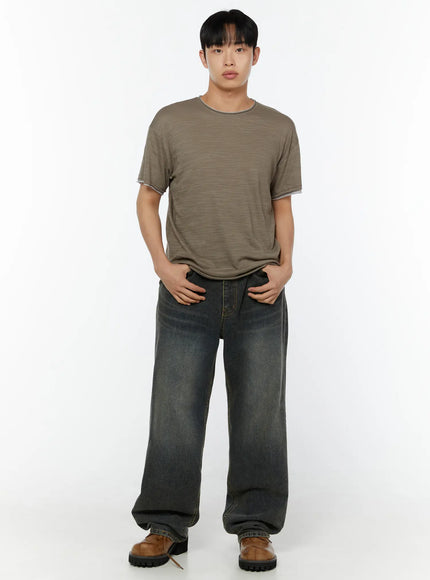 Men's Relaxed Fit T-Shirt IU529 Dark green full-body front shot on male model hands in pockets relaxed stance styled with wide-leg denim