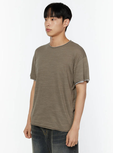Men's Relaxed Fit T-Shirt IU529 Dark green side shot on male model showing slub texture crew neck and double-layer sleeve cuff detail