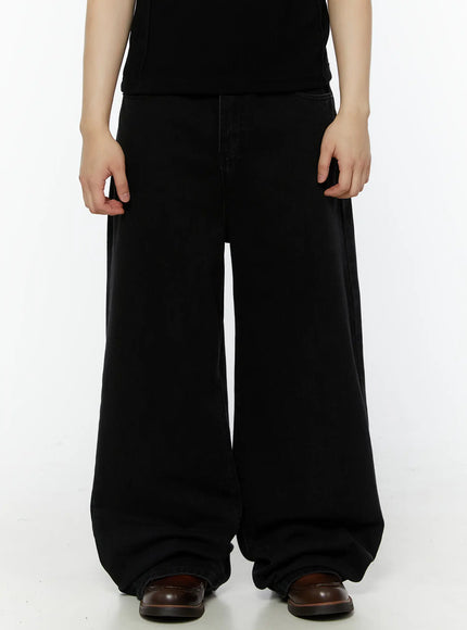 Men's Relaxed Fit Wide Leg Jeans IL509 Black front view on model standing straight, showing ultra-wide leg silhouette and pooling hem, styled with black tee and brown loafers