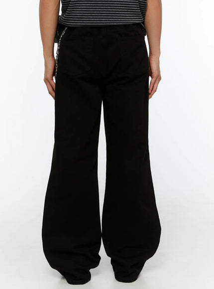Men's Semi-Flared Black Pants IL509 Black back view on model showing rear yoke seam silver chain accessory and flared wide-leg hem