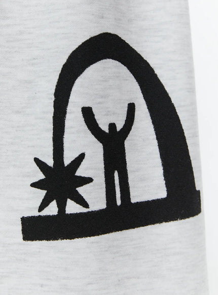 Men's Shooting Star Printed Shorts (Light Gray) IL509 Light gray close-up detail of black arch figure and star graphic print on heathered cotton fabric