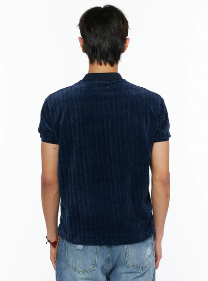 Men's Short Sleeve Velour Polo Shirt IL520 Navy back shot on male model showing ribbed velour fabric, collar, and contrast cuff trim