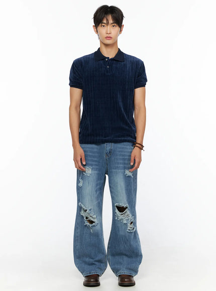 Men's Short Sleeve Velour Polo Shirt IL520 Navy full-body front shot on male model standing straight with ripped wide-leg jeans
