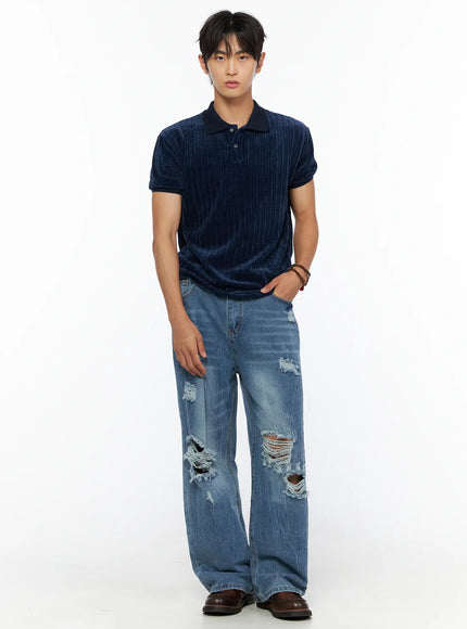 Men's Short Sleeve Velour Polo Shirt IL520 Navy full-body front shot on male model with hand in pocket wearing distressed jeans and loafers
