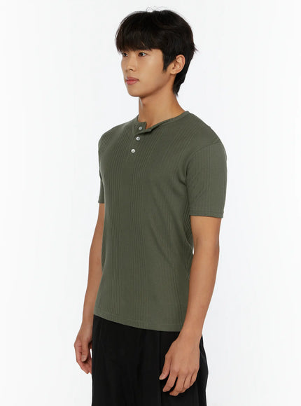 Men's Slim Fit Ribbed T-Shirt IL513 Dark green side shot on male model showing ribbed texture slim silhouette and short sleeve detail with black pants