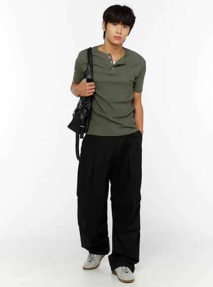 LEWKIN Men's Slim Fit Ribbed T-Shirt IL513 Dark green full-length front shot on male model size M/L styled with black wide-leg pants and crossbody bag