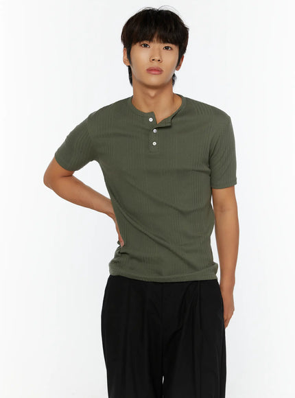 Men's Slim Fit Ribbed T-Shirt IL513 Dark green close-up front shot on male model hand on hip highlighting three-button henley placket and ribbed fabric