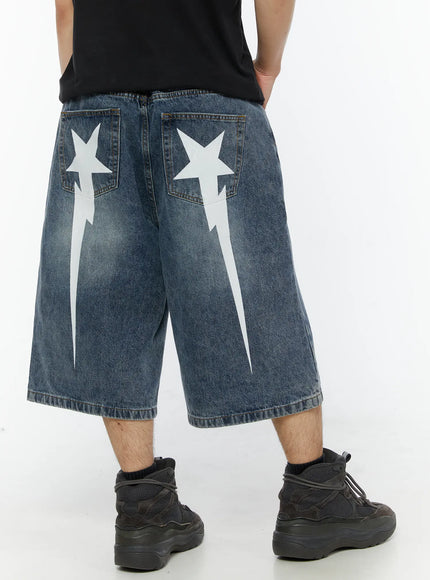 LEWKIN Men's Star Bolt Graphic Print Jorts (Blue) IL507 Blue back view on model wearing black tee and sneakers showing white star bolt print on back pockets