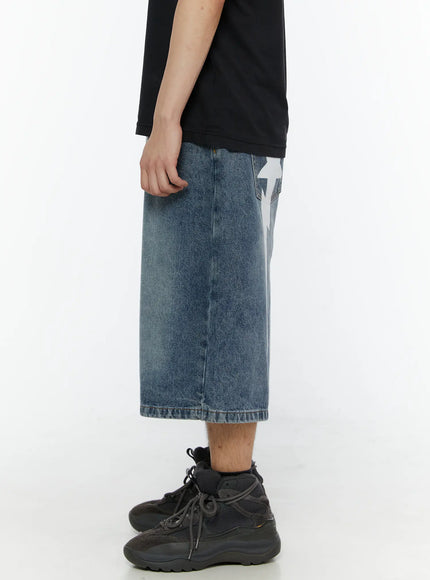 Men's Star Bolt Graphic Print Jorts (Blue) IL507 Blue side view on model showing wide-leg denim length and white lightning bolt graphic visible at back hip