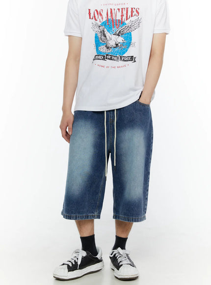 Men's Star Bolt Graphic Print Jorts (Dark Blue) IL507 front view on model styled with graphic tee and sneakers, wide-leg washed denim with cream drawstring waist