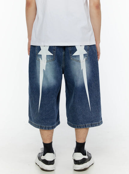 LEWKIN Men's Star Bolt Graphic Print Jorts (Dark Blue) IL507 back view on model showing dual white star-bolt graphic prints on rear pockets, wide-leg denim silhouette